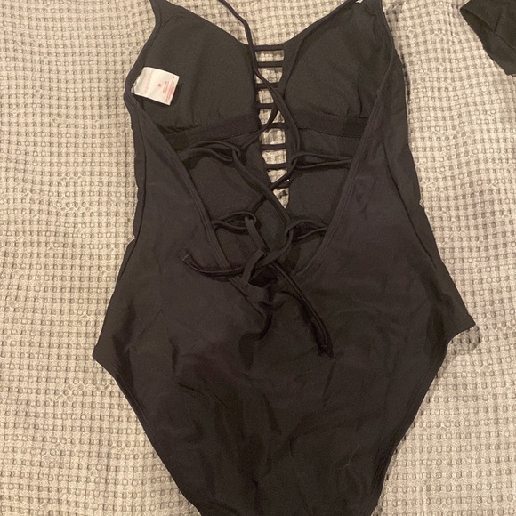 One piece black bathing suit.  High legged on bottom - Picture 3 of 5